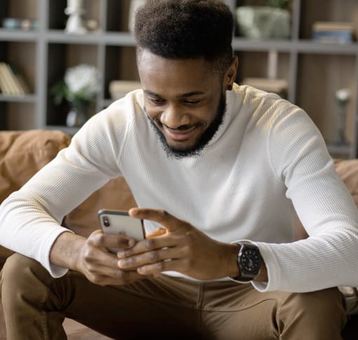 A man sitting and texting